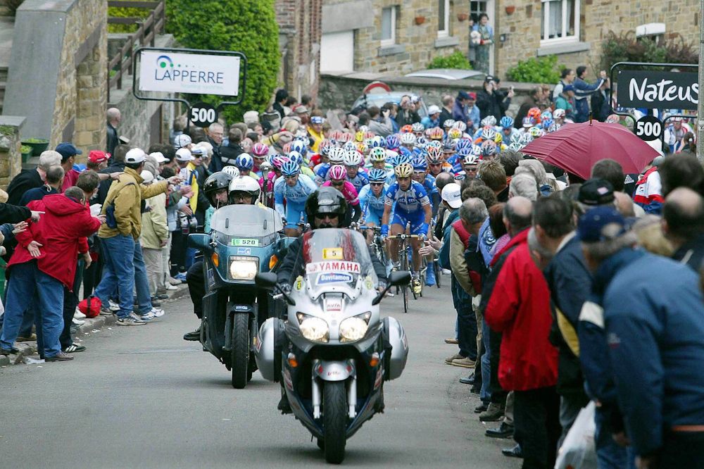 pack rides during the first pass of Huy wall, during the 2005 Fleche Wallone.