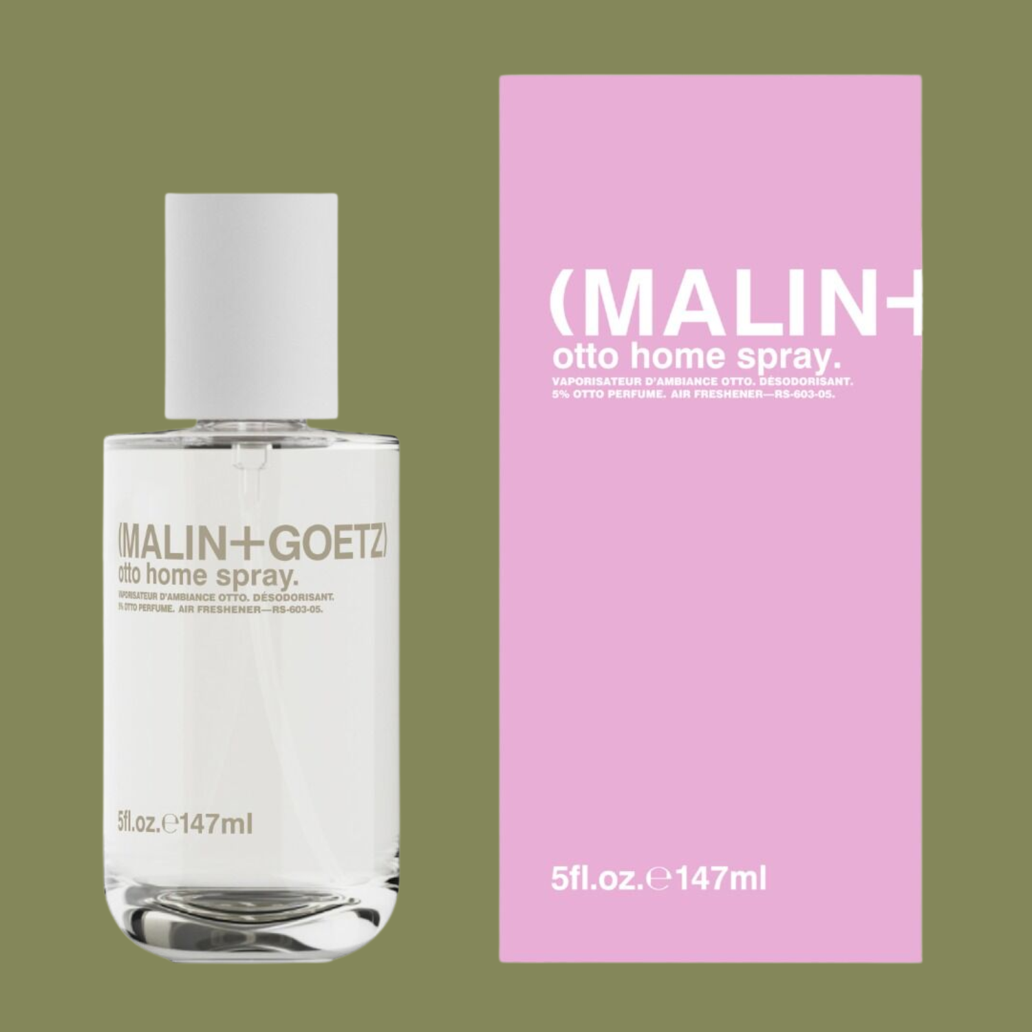 A clear home spray bottle near a pink box