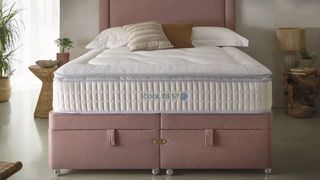 The Sleepeezee Cool Rest 1800 Mattress on a bed frame in a bedroom