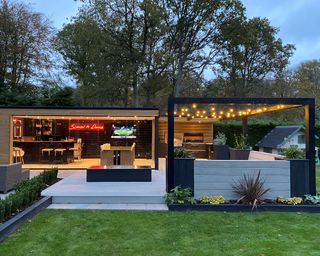 Outdoor kitchen with neon lighting and outdoor pergola lighting decor