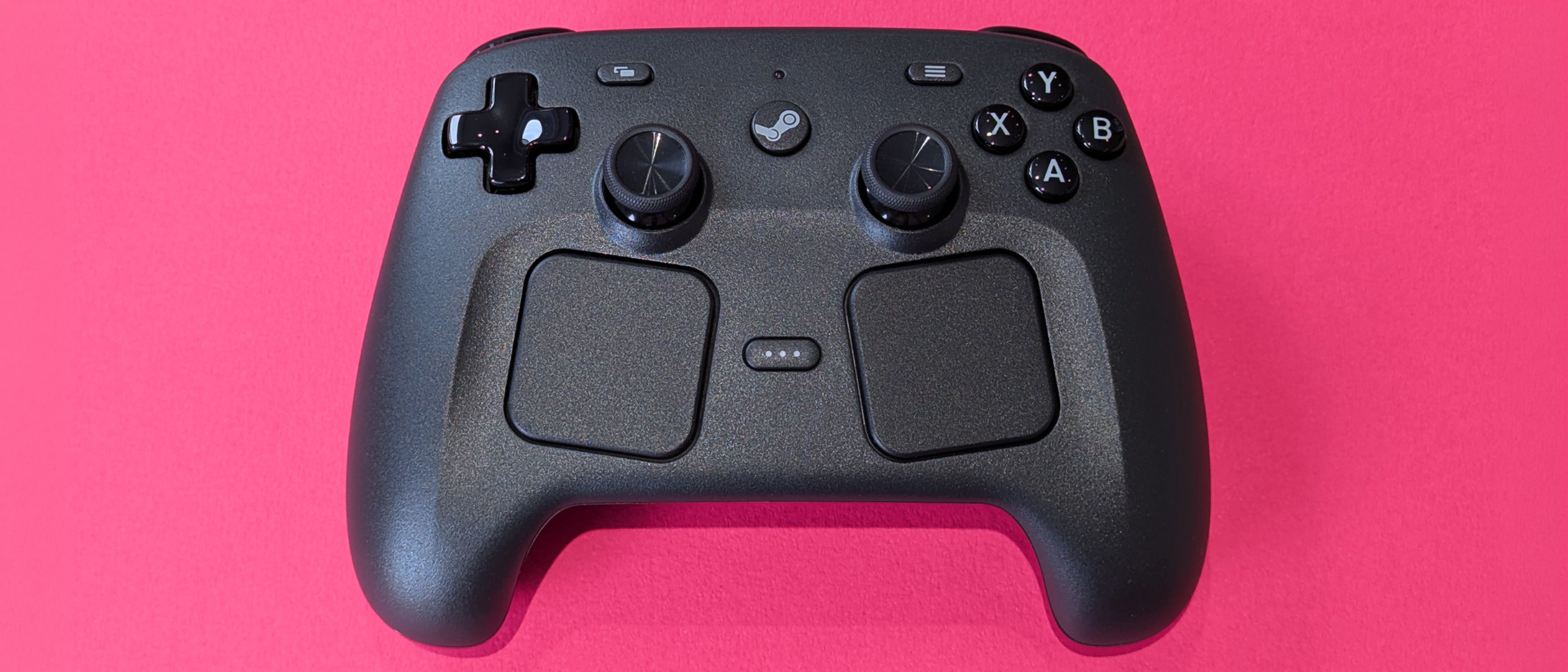 Valve Steam Controller (2026) displayed against a magenta card background