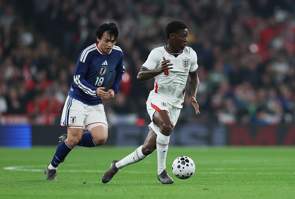 Kobbie Mainoo of England is put under pressure by Ayase Ueda of Japan during the international friendly match between England and Japan at Wembley Stadium on March 31, 2026 in London, England.