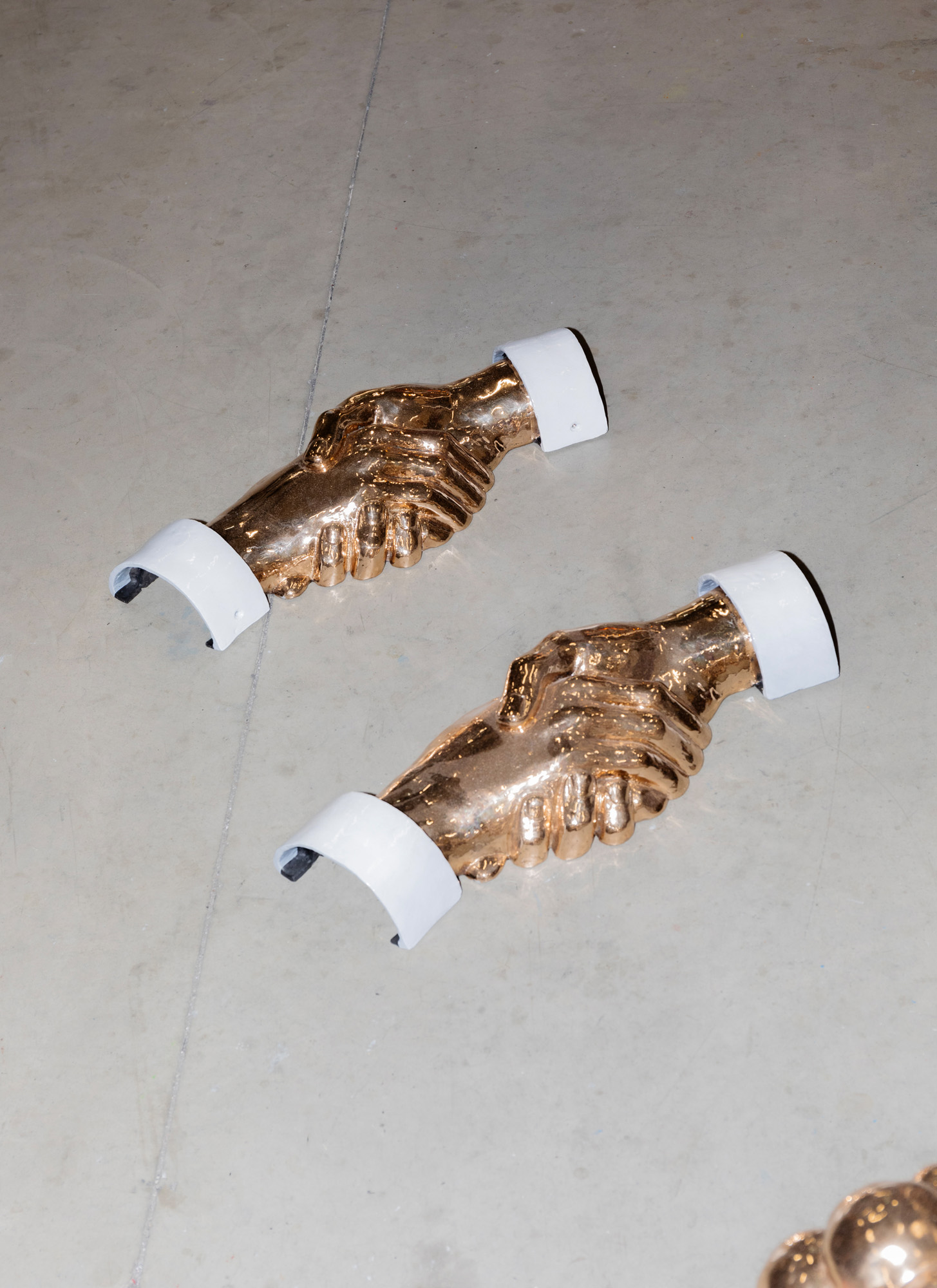 Handshake sculptures on floor of Studio Job atelier in Tilburg