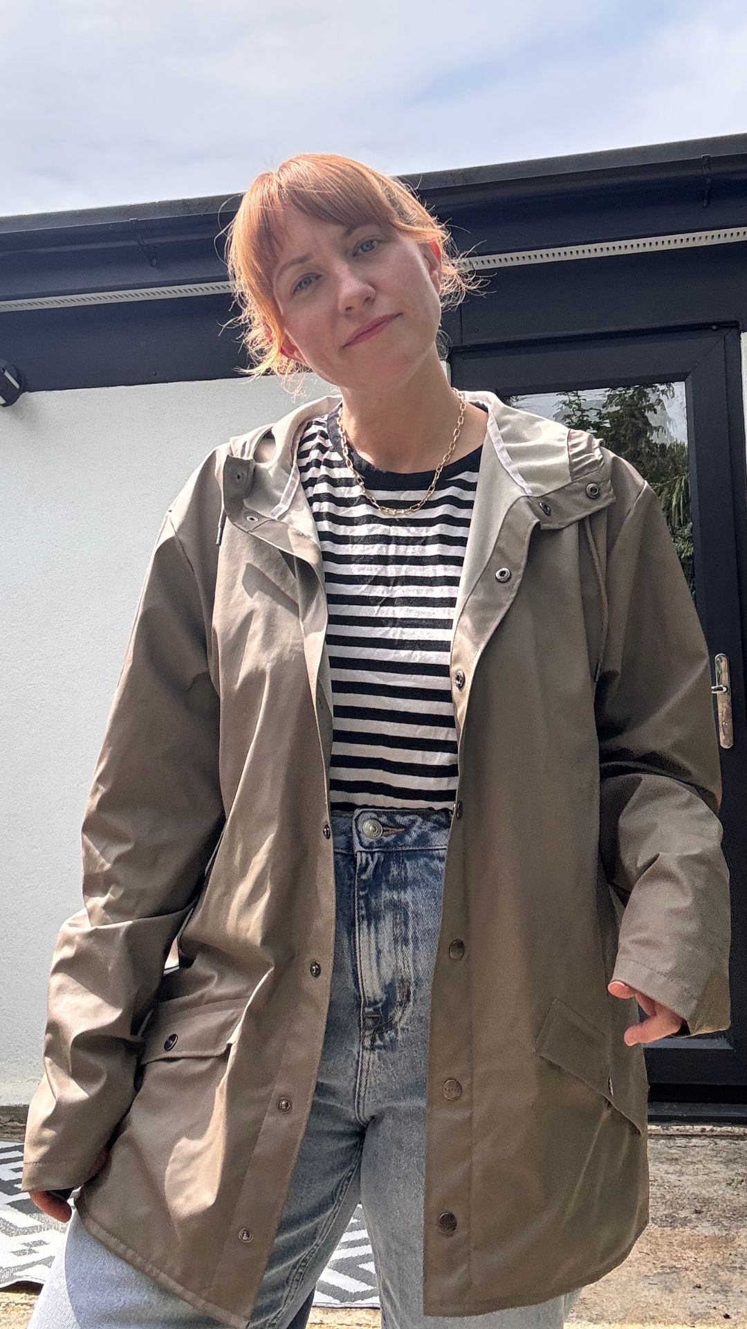 matilda wearing the rains waterproof jacket