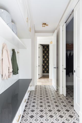 A mudroom with tiled flooring