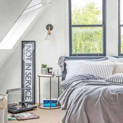 White loft with blue bedding