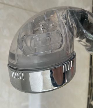 The shower head has a switch on the side with 3 different levels of power