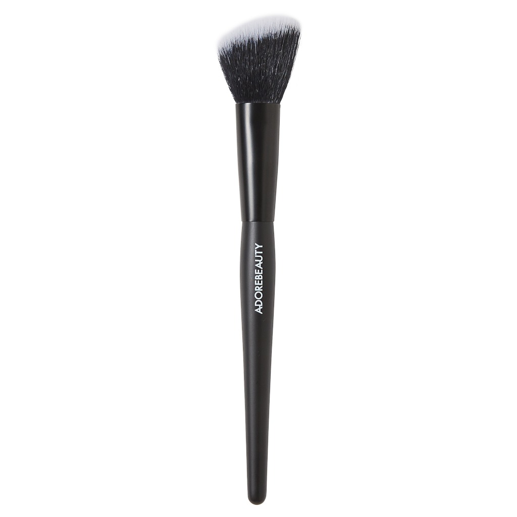 Black makeup brush that says Adore Beauty in white and black and white bristles