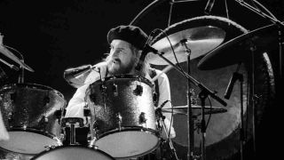 Mick Fleetwood playing drums onstage in 1977