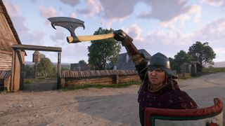 Kingdom Come Deliverance 2 Henry holding the silver axe aloft