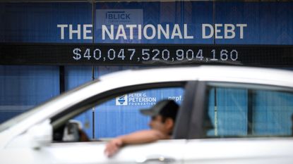 An electronic display shows the national debt in Washington, D.C.