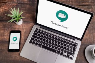 Computer and smartphone showing Google Meet app logo