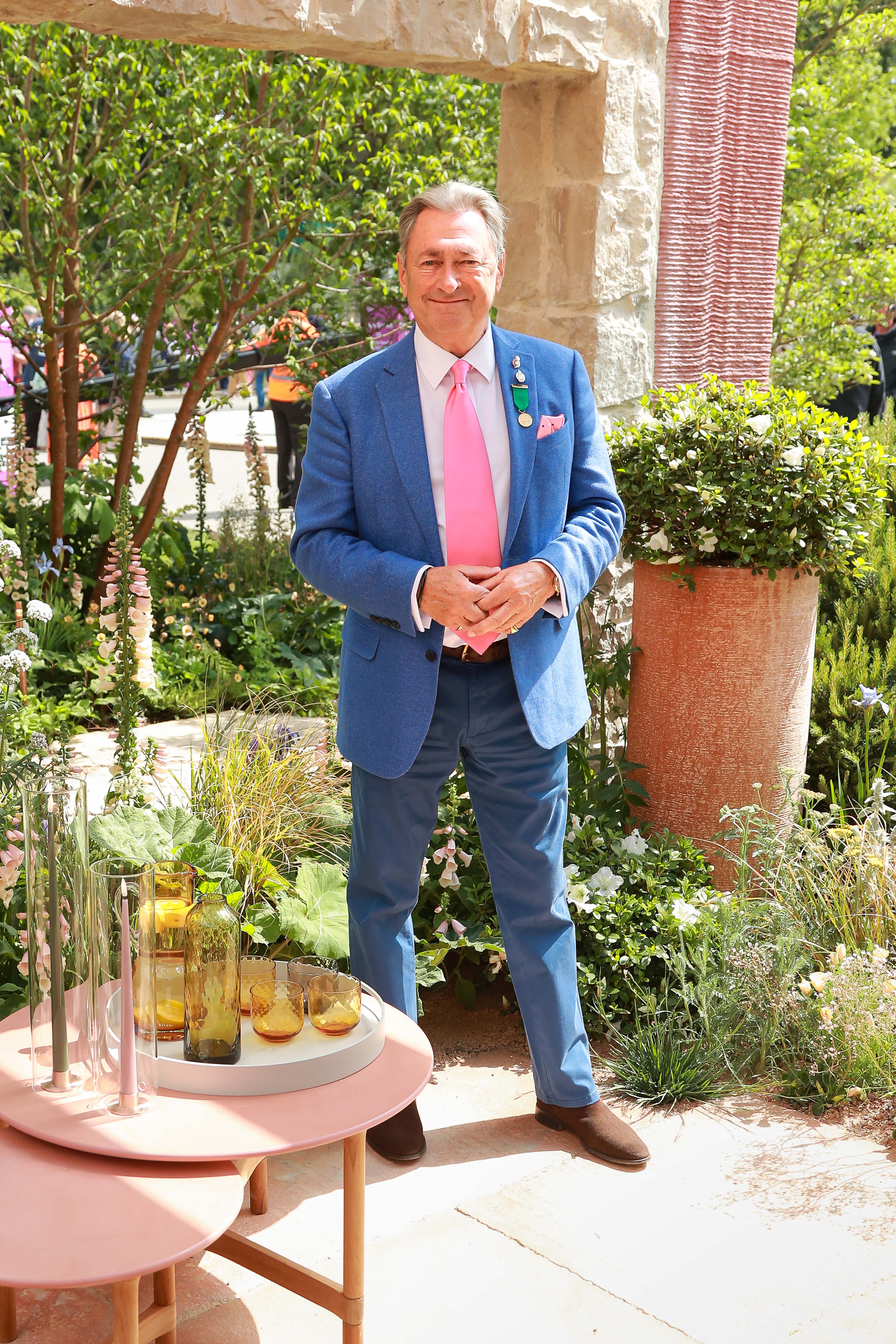 Alan Titchmarsh in a blue suit and pink tie