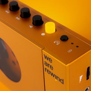 Detail of controls and logo on orange Cassette Player by We Are Rewind