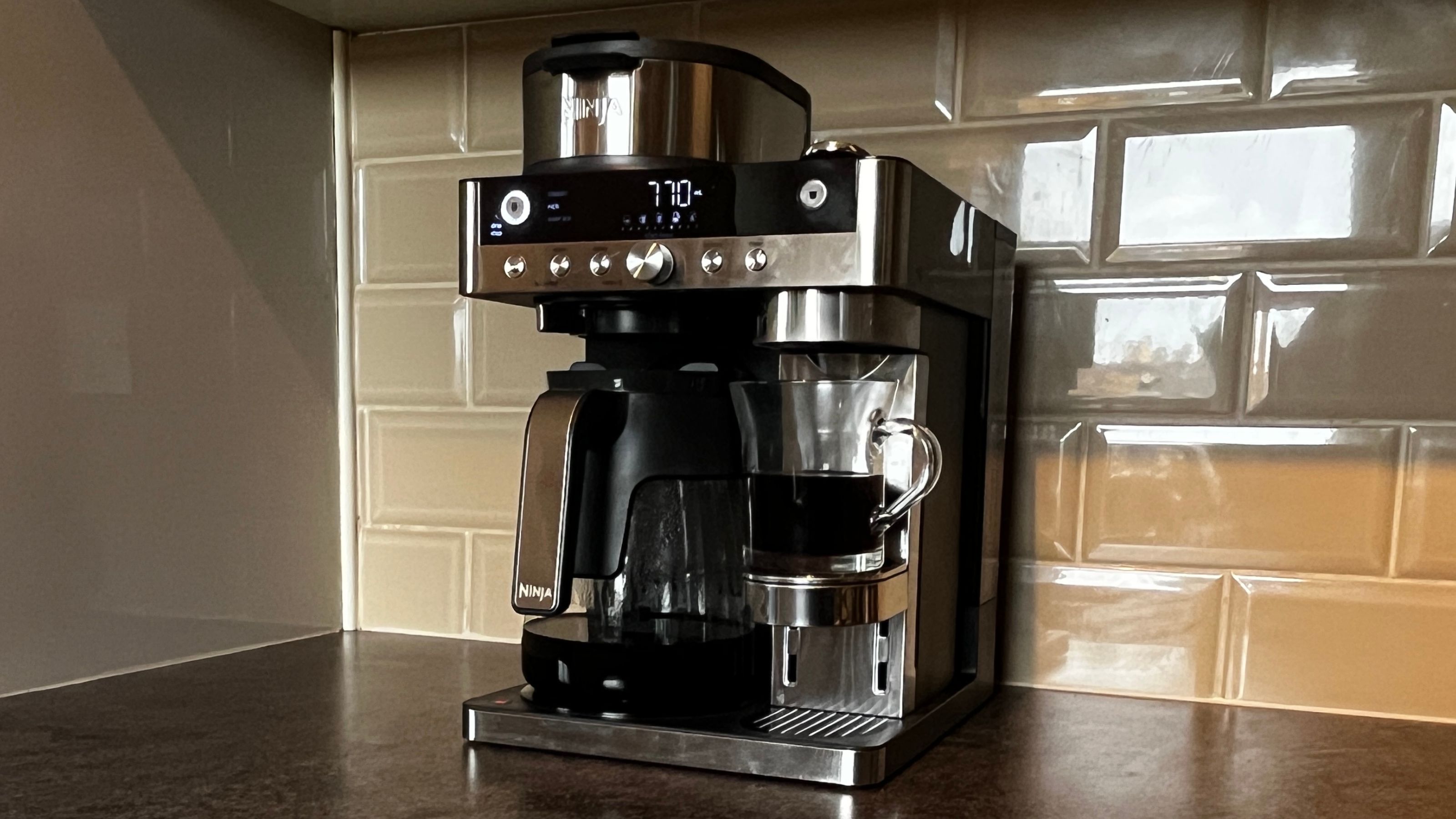 Ninja Prestige Dualbrew System with half a carafe of black coffee