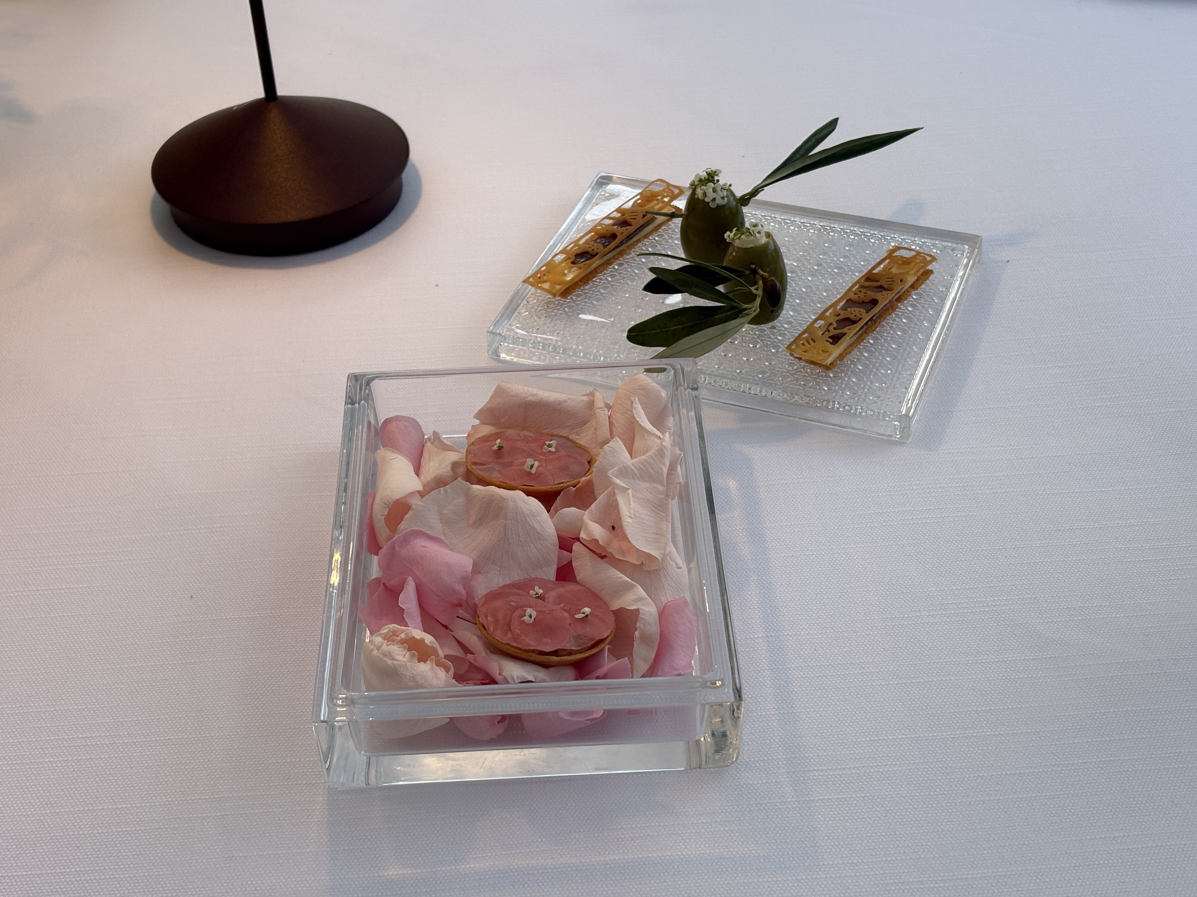 view of some of the dishes at monsieur dior restaurant by mauro colagreco