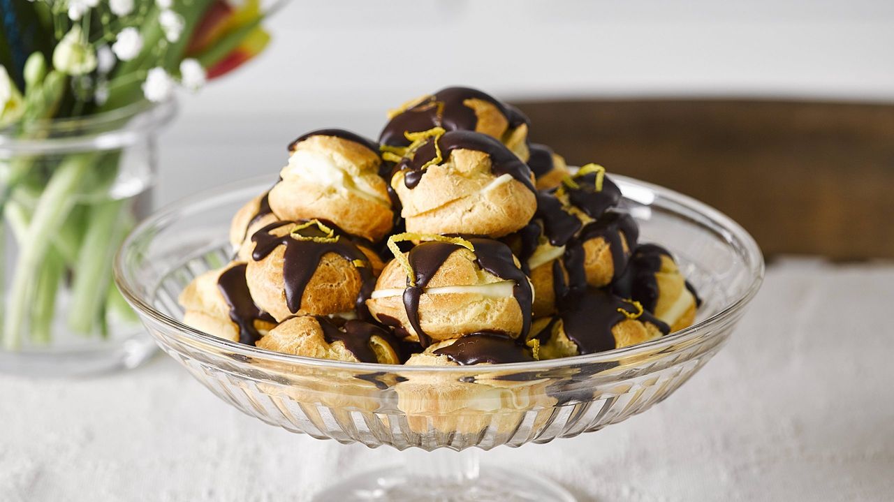 lemon filled profiteroles with dark chocolate lemon drizzle