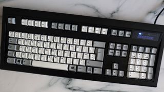 Unicomp New Model M keyboard on a countertop