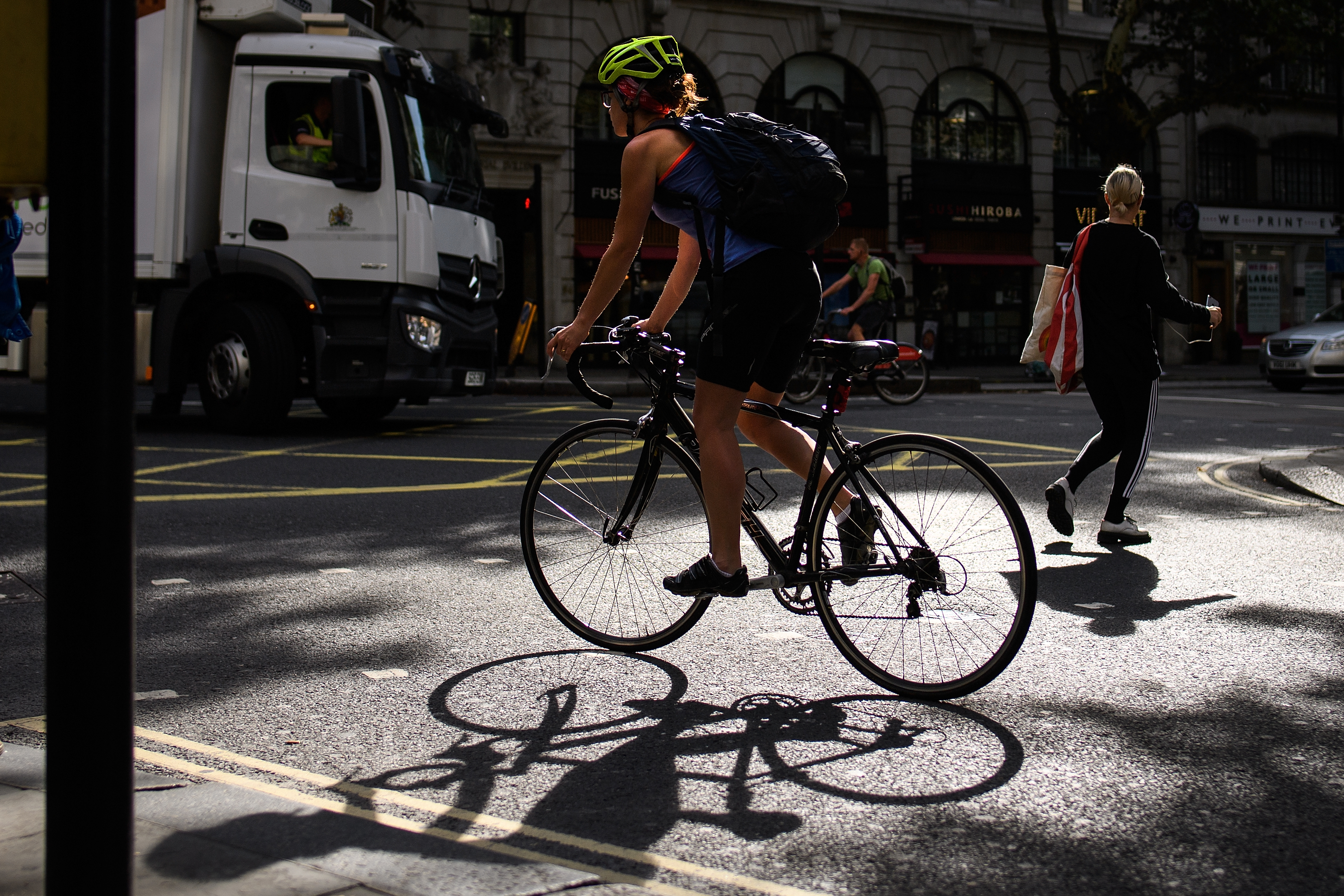 A cyclist negotiates the busy streets of London