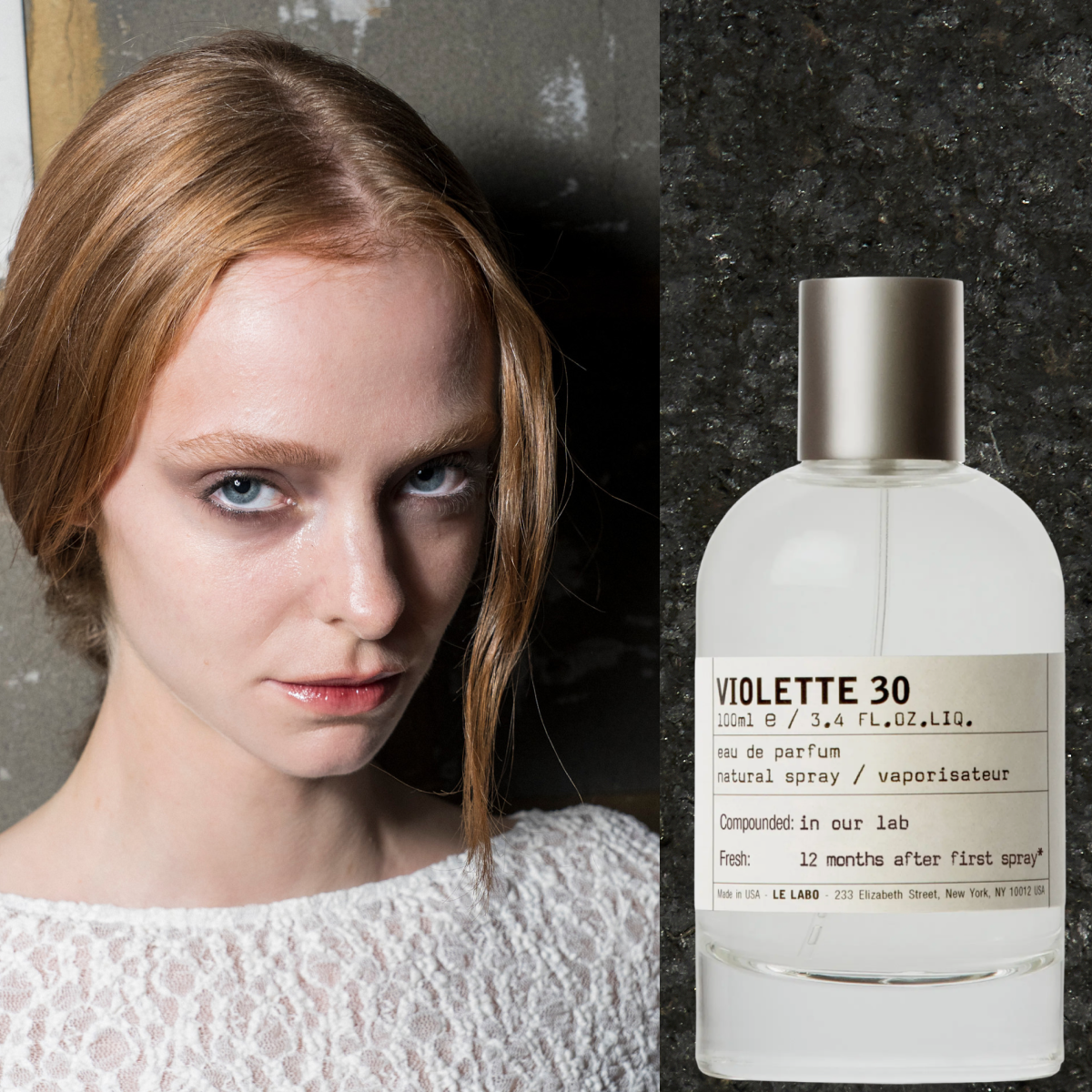 Woman with red hair in a low pony wearing a white lacy shirt. She is next to two bottles of perfume
