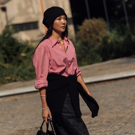woman wearing button-down and a black skirt
