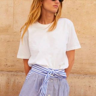 Balzac paris Bree white t-shirt on model paired with blue and white striped shirt