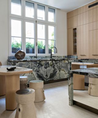 wooden kitchen with large run of all marble cabinets