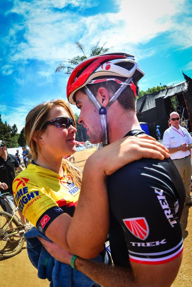 Under 23 women's cross country ninth place finisher Candice Neethling (Velo Life/BMC-SA) celebrates with boyfriend, under 23 men's cross country fourth place finisher James Reid (Trek Racing SA)