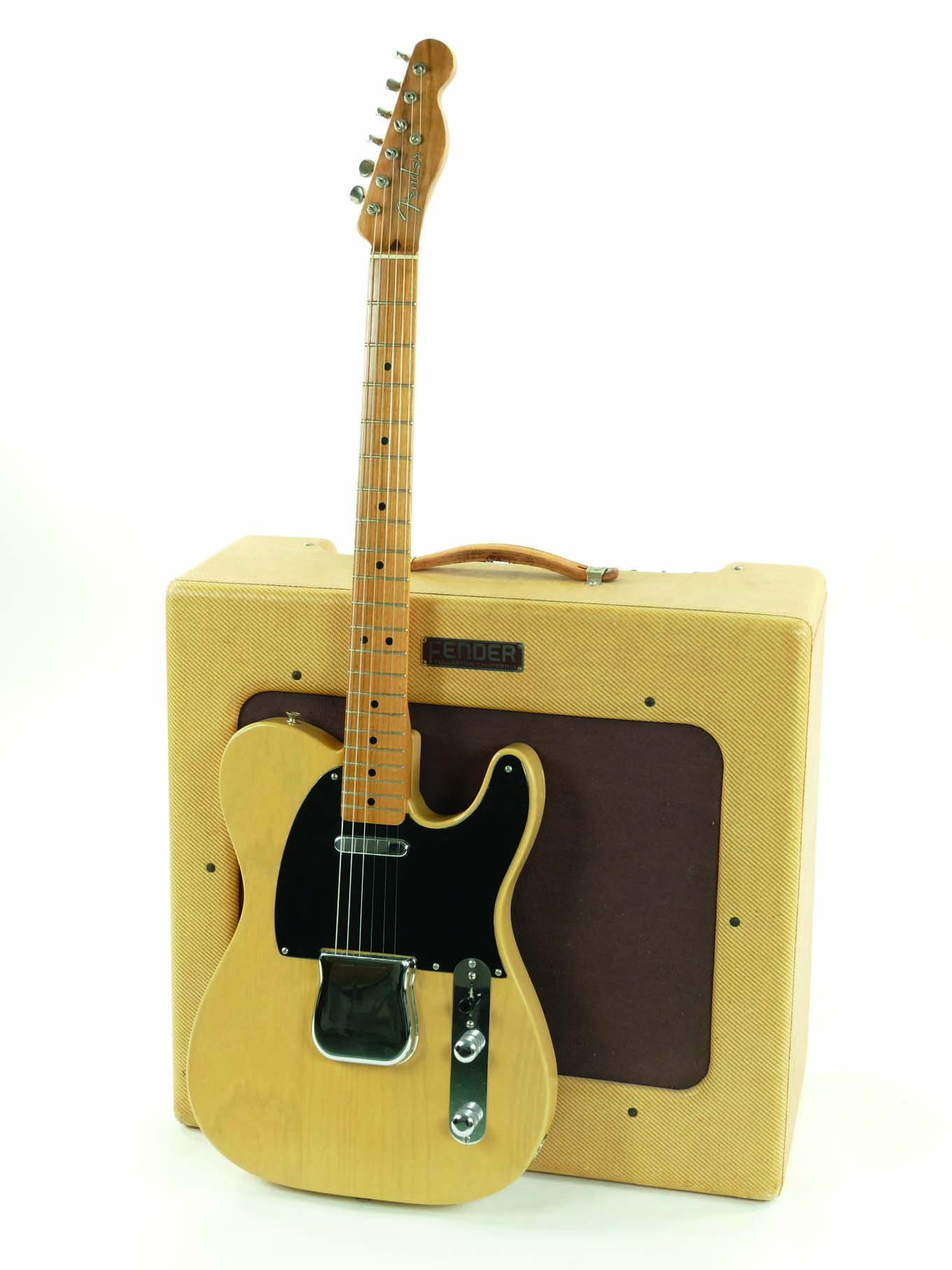 An original 1951 Nocaster leans against a TV-front Pro Amp