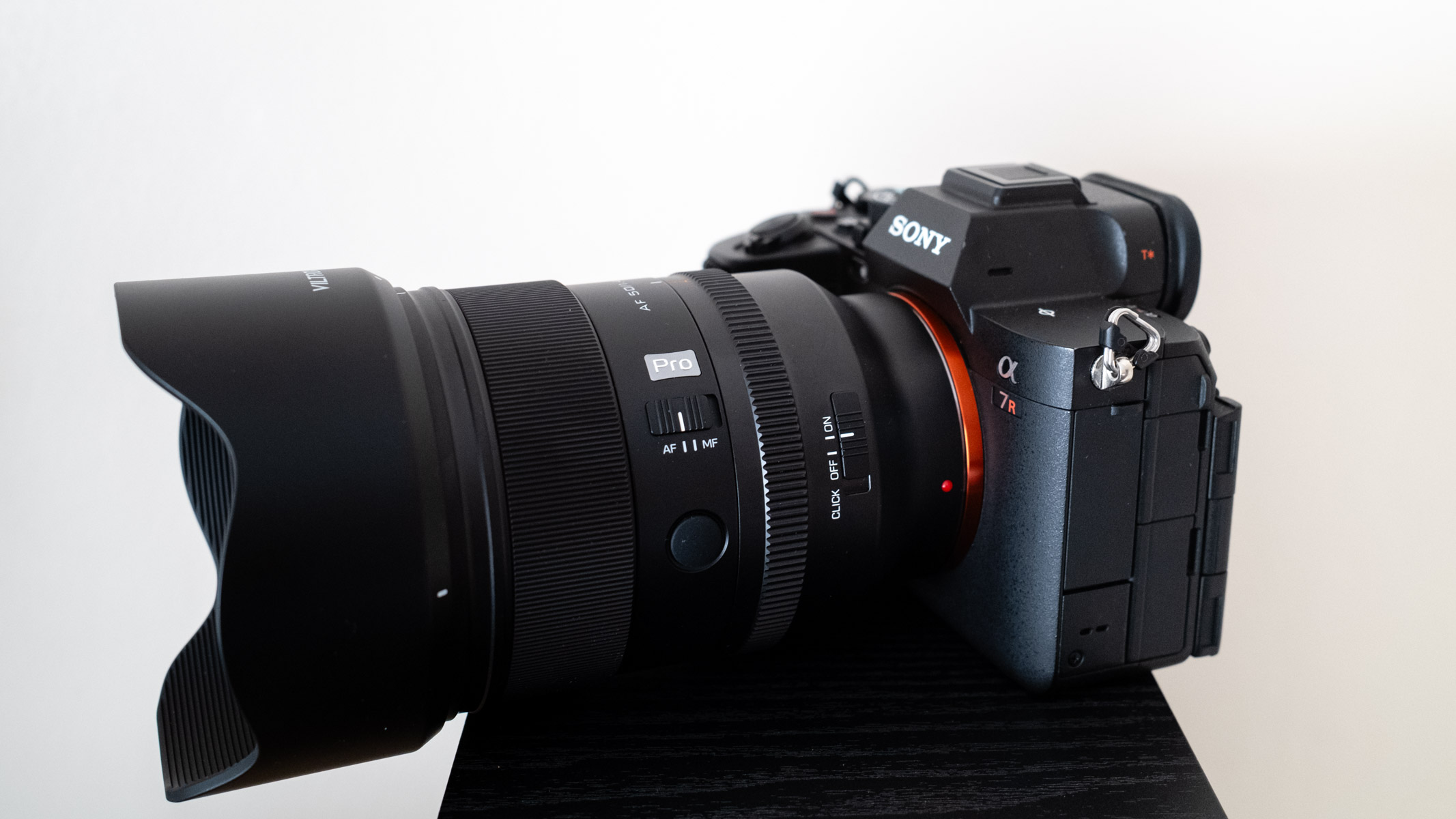 Viltrox AF 50mm f/1.4 Pro FE side view with the lens hood attached