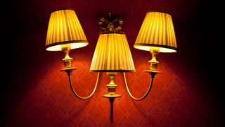 Three lights heavily dimmed by lampshades