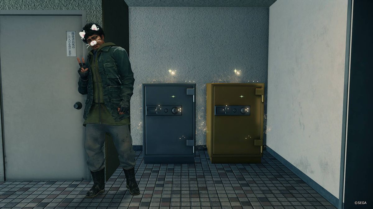 Yakuza: Like A Dragon - Nanba posing with a silver safe and gold safe