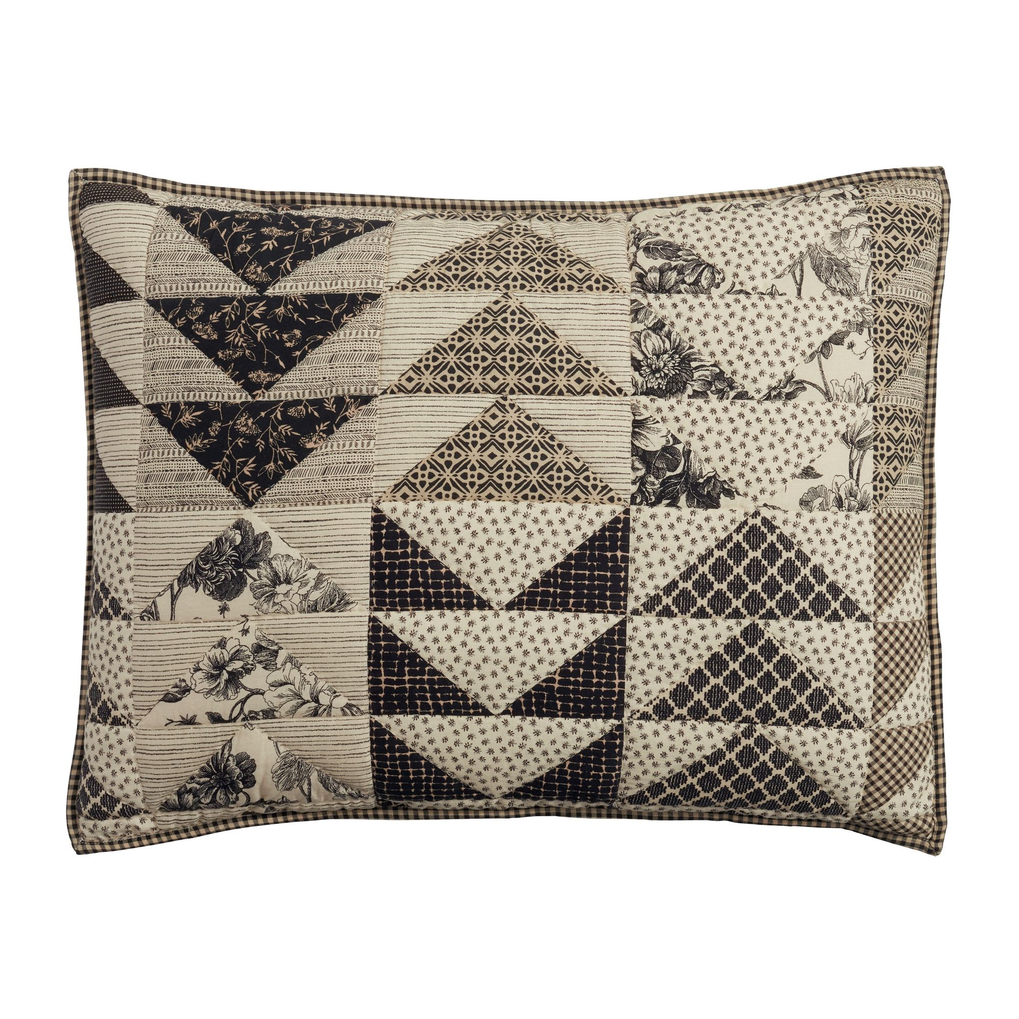 a black and white patchwork pillow