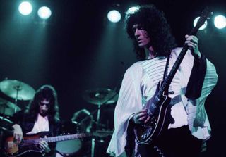 Brian May and John Deacon onstage