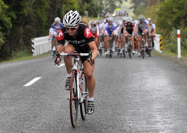 Emily Collins of the Cyclosport team is the next to attack the peloton.
