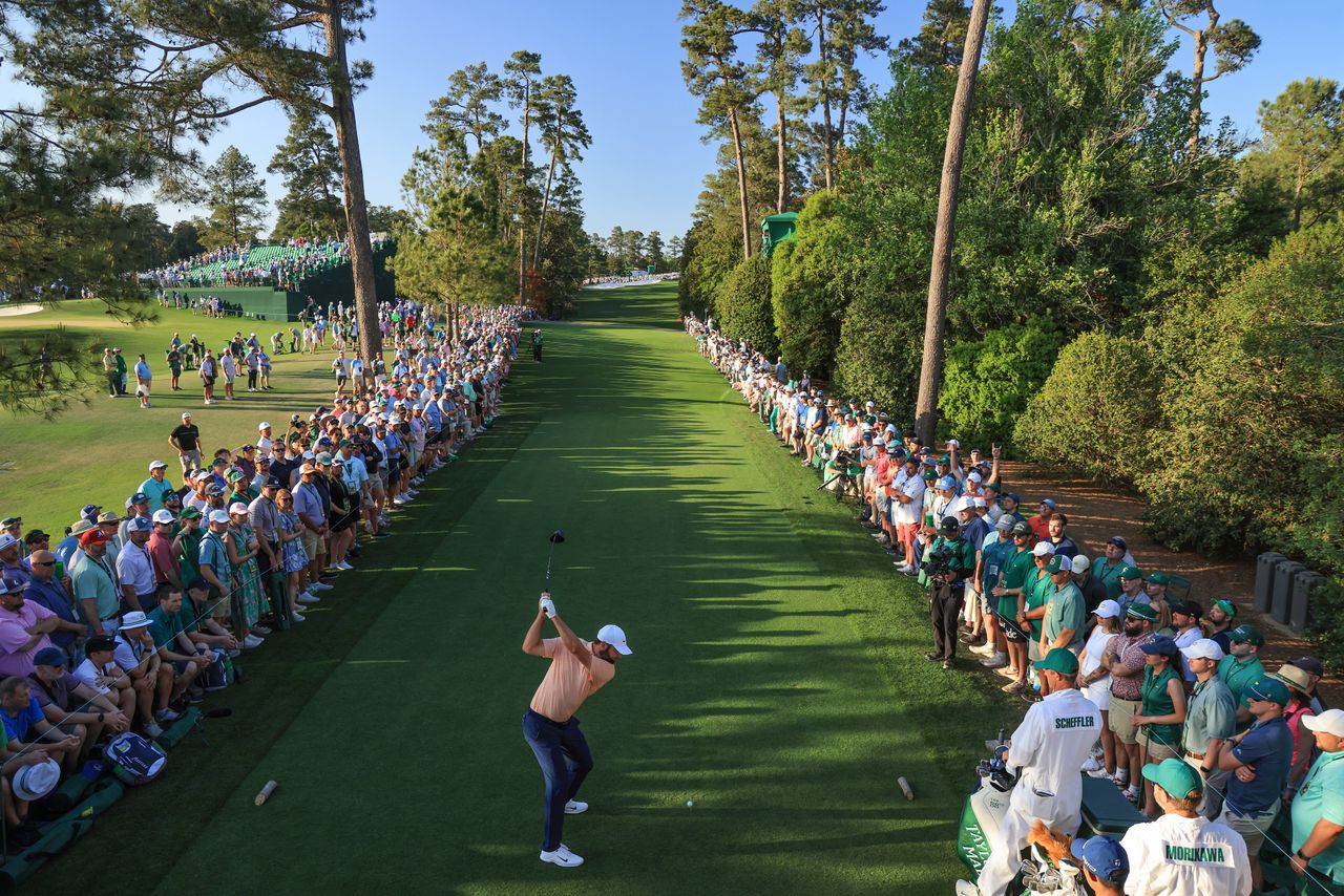 Scottie Scheffler hits his tee shot on 18 at Augusta National