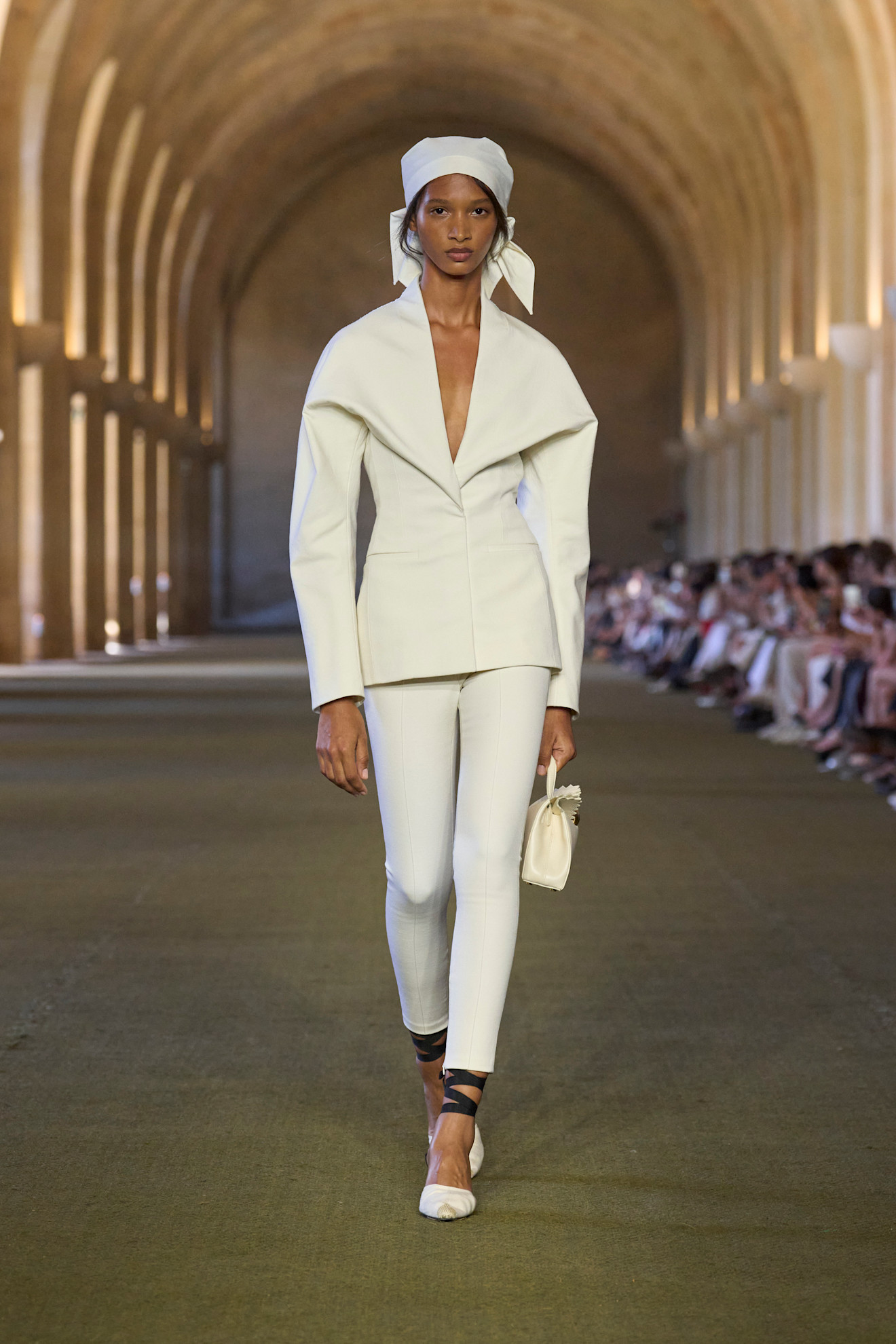Model wears an all white outfit on the Jacquemus Spring Summer 2026 runway
