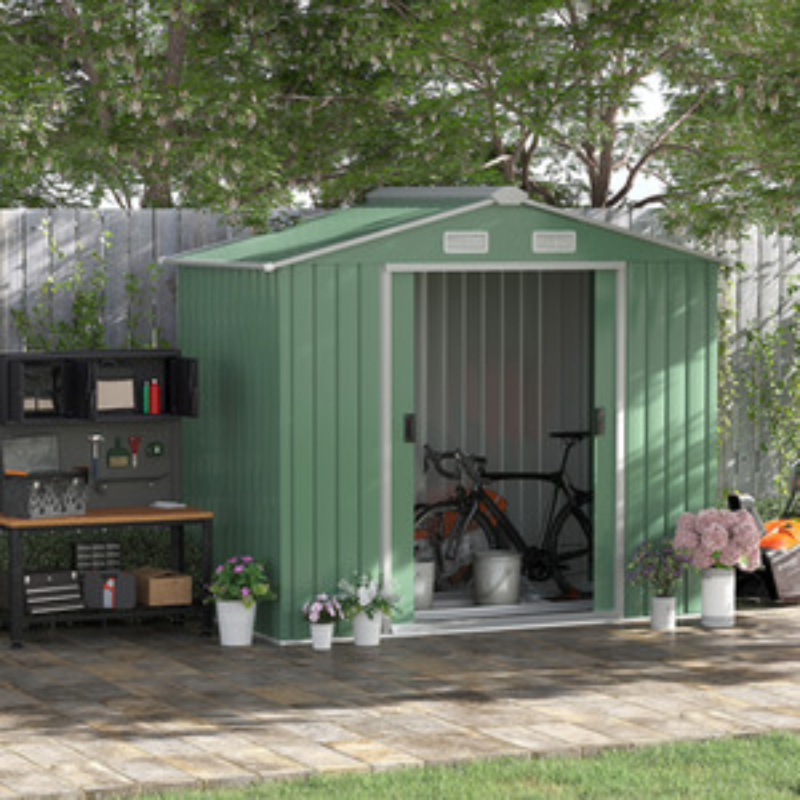 green metal shed with pitched roof