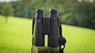 Leica ultravid 8x50 HD on a fence post