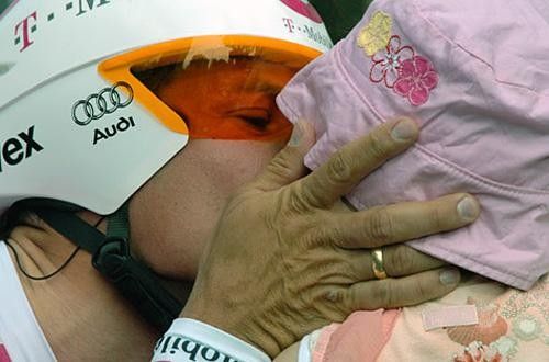 Pollack kisses his daughter before the start