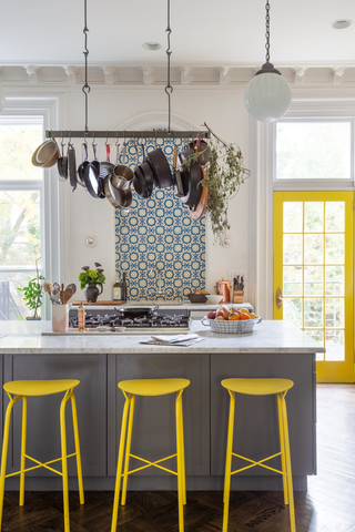 grey kitchen ideas with grey island and yellow bar stools