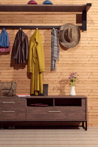 Boot room with wooden wall