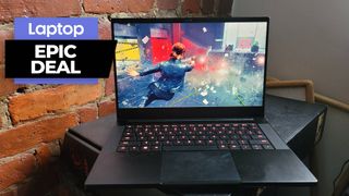 Razer Blade 14 gaming laptop in black with red backlit keys against a brick wall background