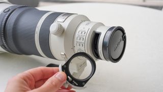 A picture of the Sony 100-400mm f/4.5 GM lens, showing the drop-in filters at the base of the lens.