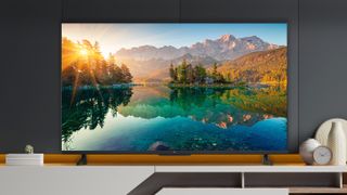 TCL 6-Series in a room with dark walls and wood trim