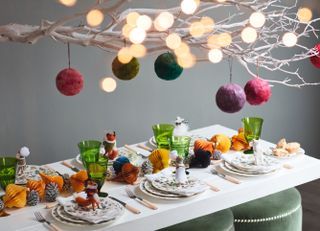 Colourful Christmas tablescape and centerpiece with baubles by OKA