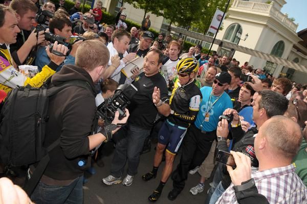Lance Armstrong (Astana) was literally mobbed by fans and photographers.