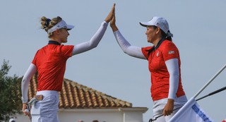 Nelly Korda and Alissen Corpuz high-five at the Solheim Cup