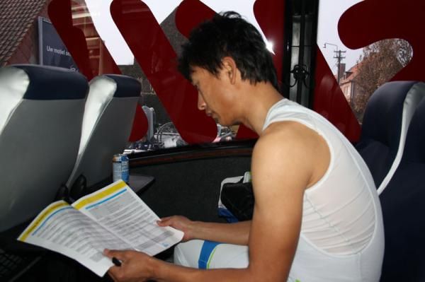 Cheng checks the race manual