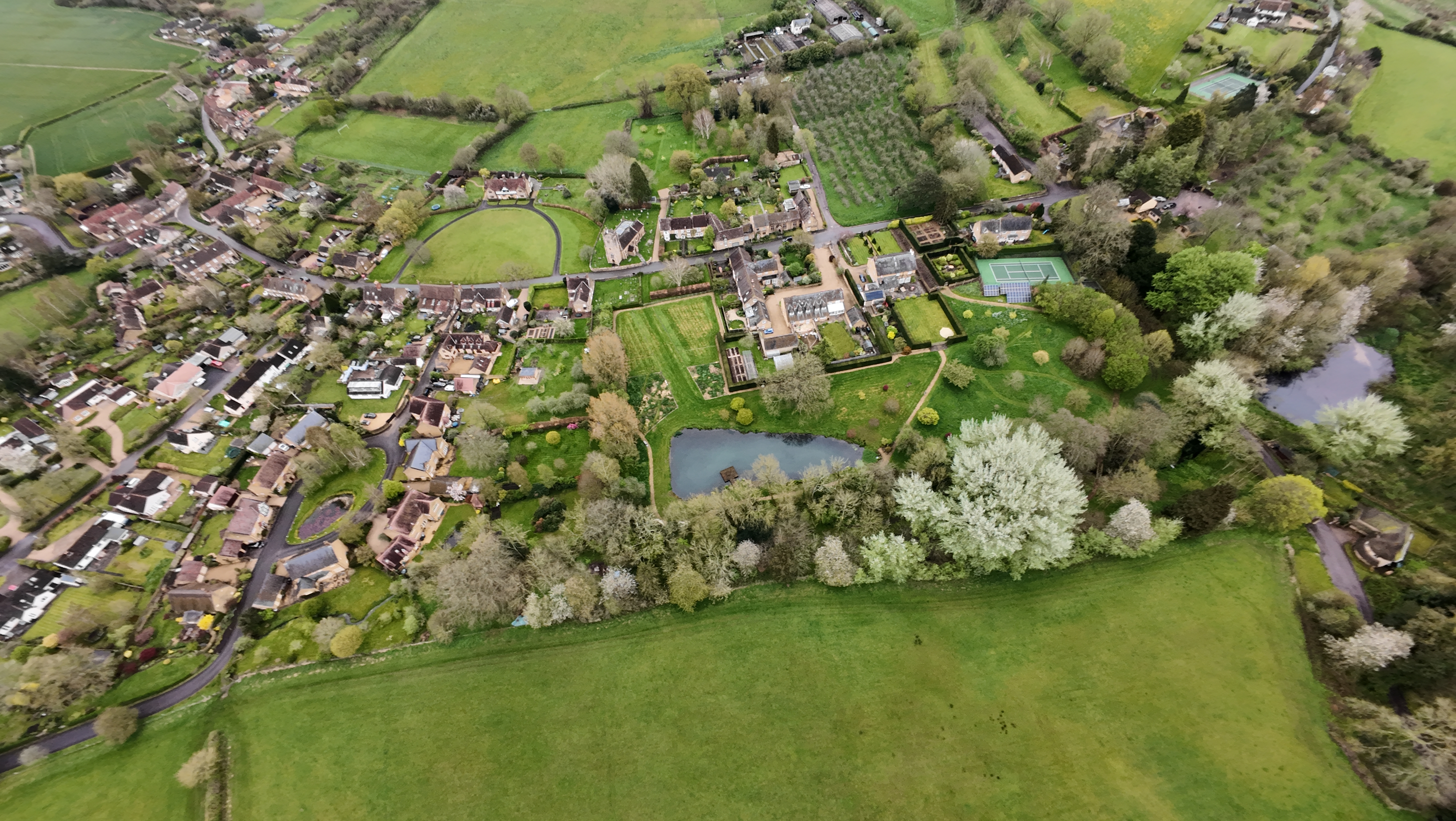 Aerial images of rural UK village and fields on an overcast day taken with the DJI Avata 2